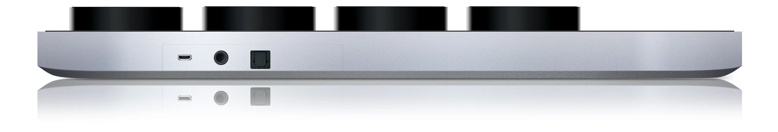 The puck receivers are charged via wireless induction, and the base has USB, 3.5 mm jack and optical connectivity