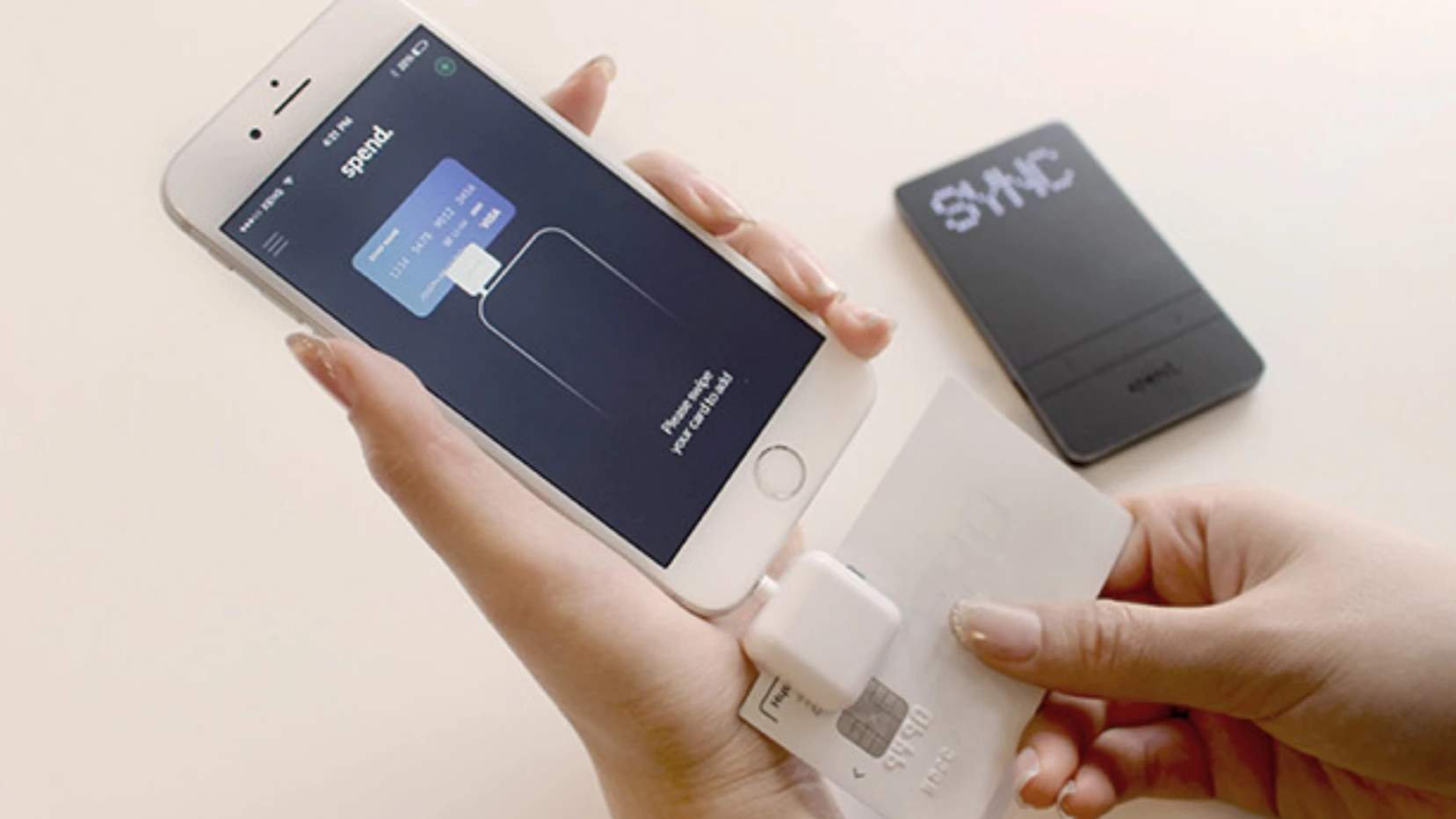 To set up a new card, the user has to swipe it through the included reader, which plugs into a smartphone headphone jack