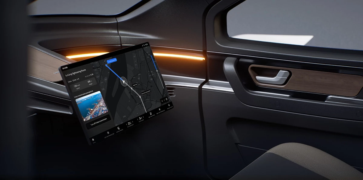 The cabin appears to feature simple but luxurious appointments and a touchscreen for flight info, mobile office work, and entertainment options