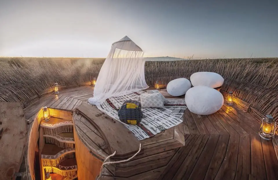 After a day out on safari, visitors to the Bird Nest hotel can return enjoy the sunset from the nest-inspired rooftop