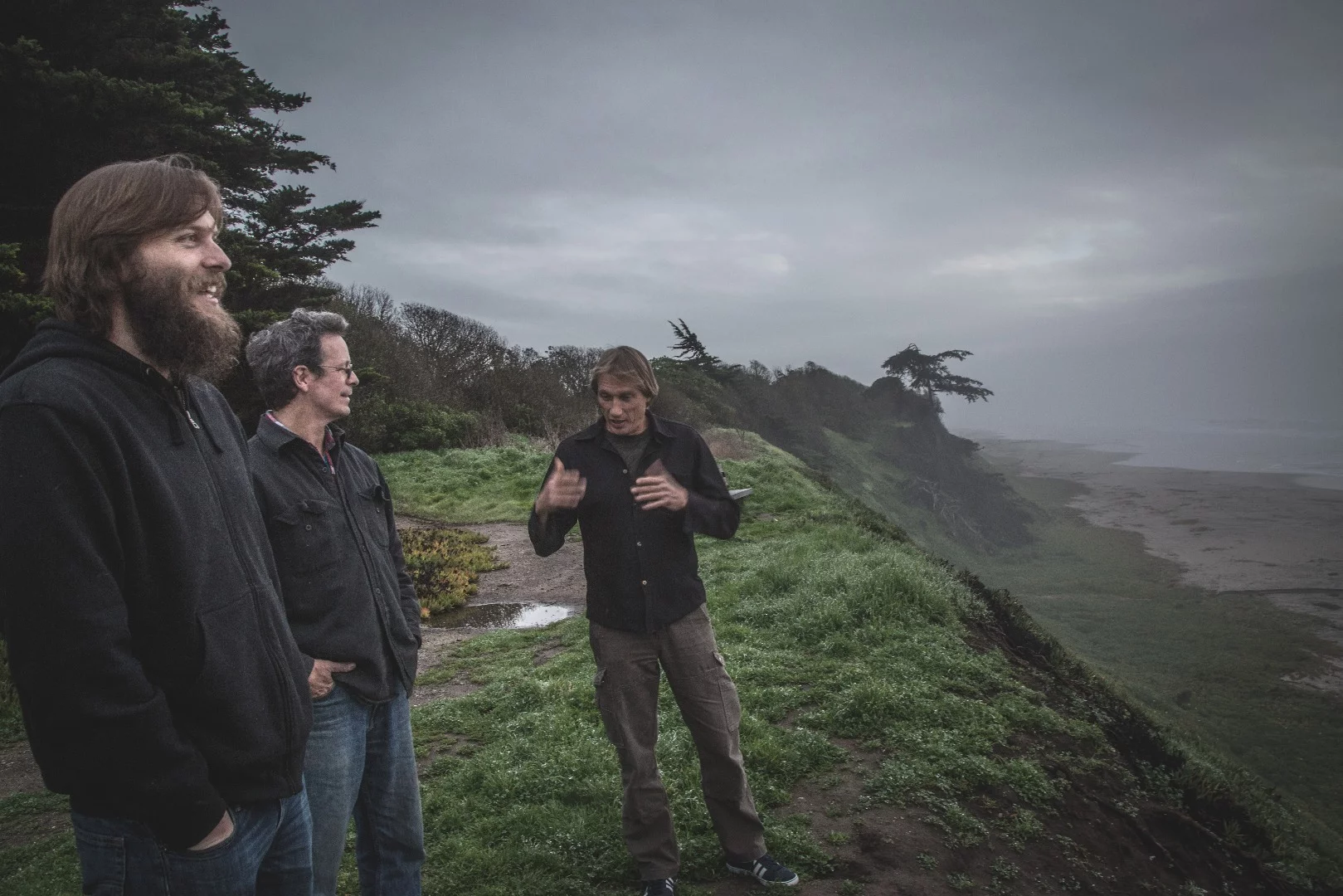 Dezso Molnar, Craig Calfee and Luke Workman discussing electric aviation on the Santa Cruz coastline