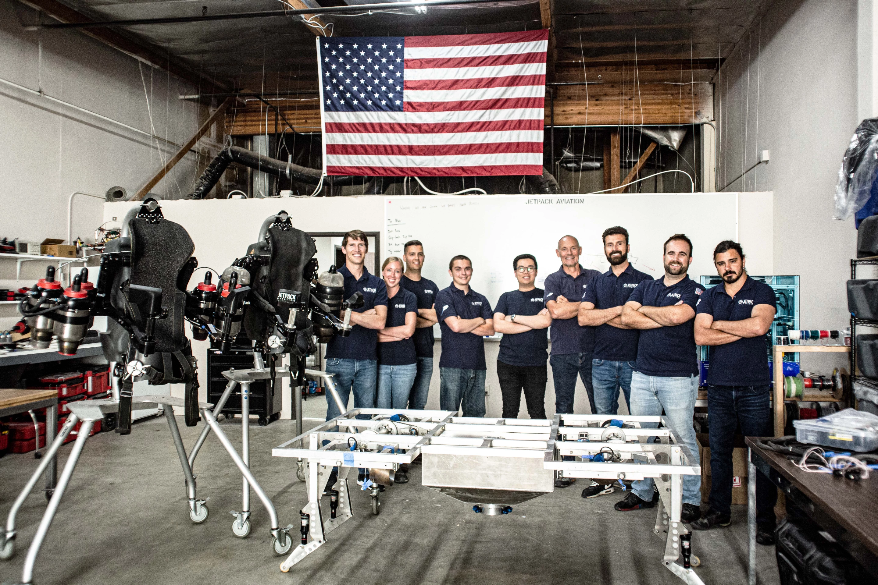 The JPA team with a Speeder prototype frame and a pair of JB-series jetpacks