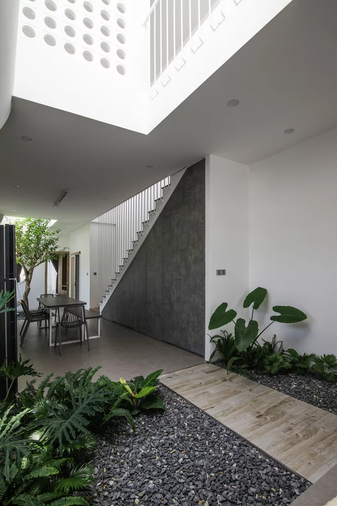 Flow House boasts cathedral high ceilings and crisp white walls