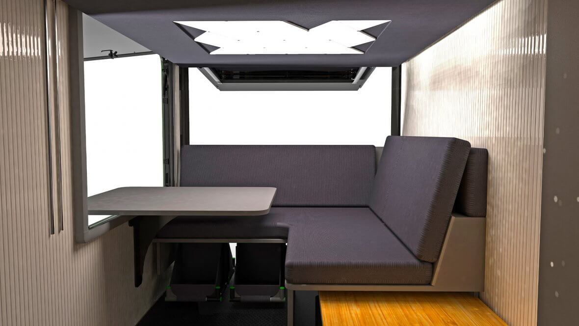 The multi-position table can be set up partially through the large side window, creating an indoor/outdoor bar/dining lounge