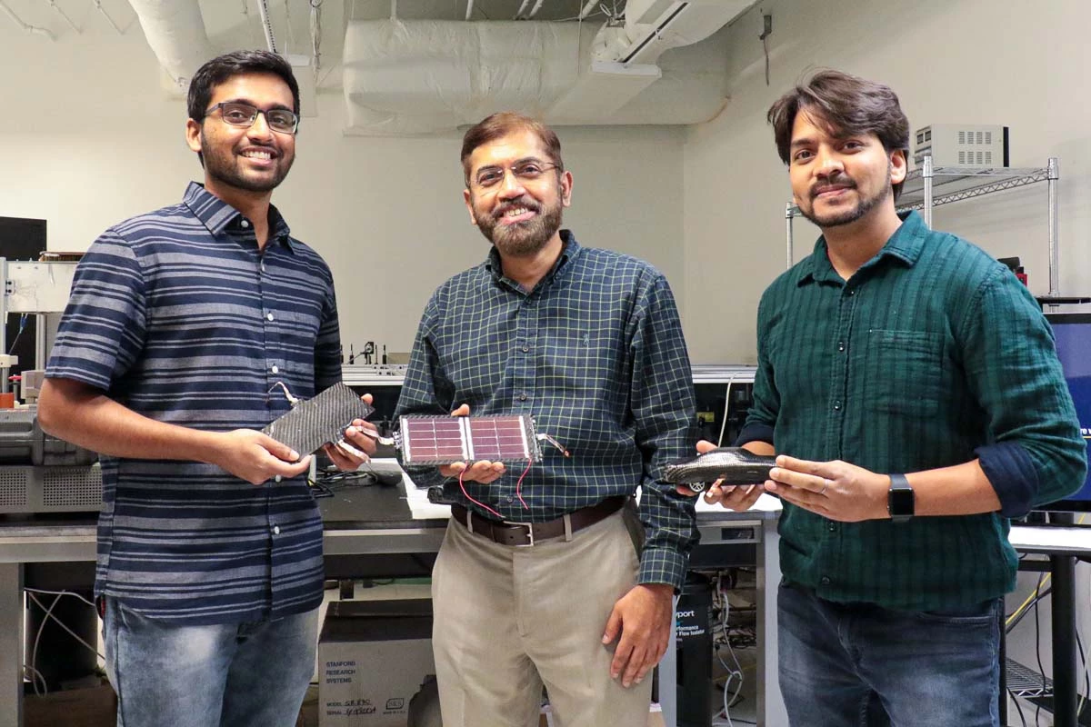 UCF researchers Kowsik Sambath Kumar, Jayan Thomas, and Deepak Pandey with samples of their battery-supercapacitor hybrid material that could form "power suits" for electric vehicles