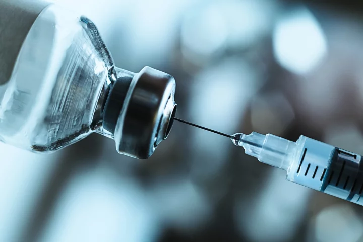 Close-up of a hypodermic needle in a vaccine