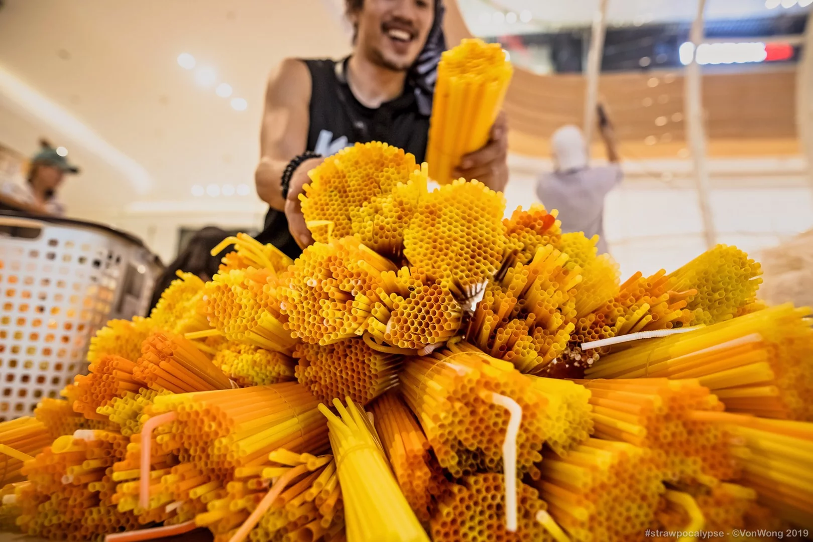Benajmin Von Wong at work on the Strawpocalypse installation