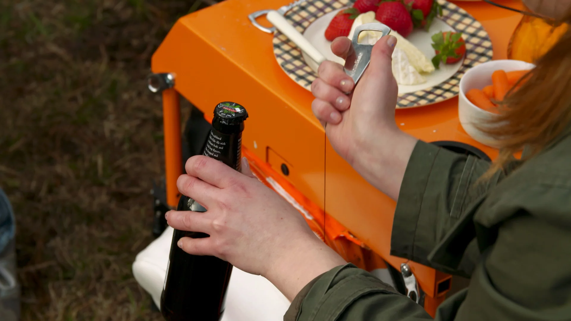 The central cooler bag includes a retractable bottle opener