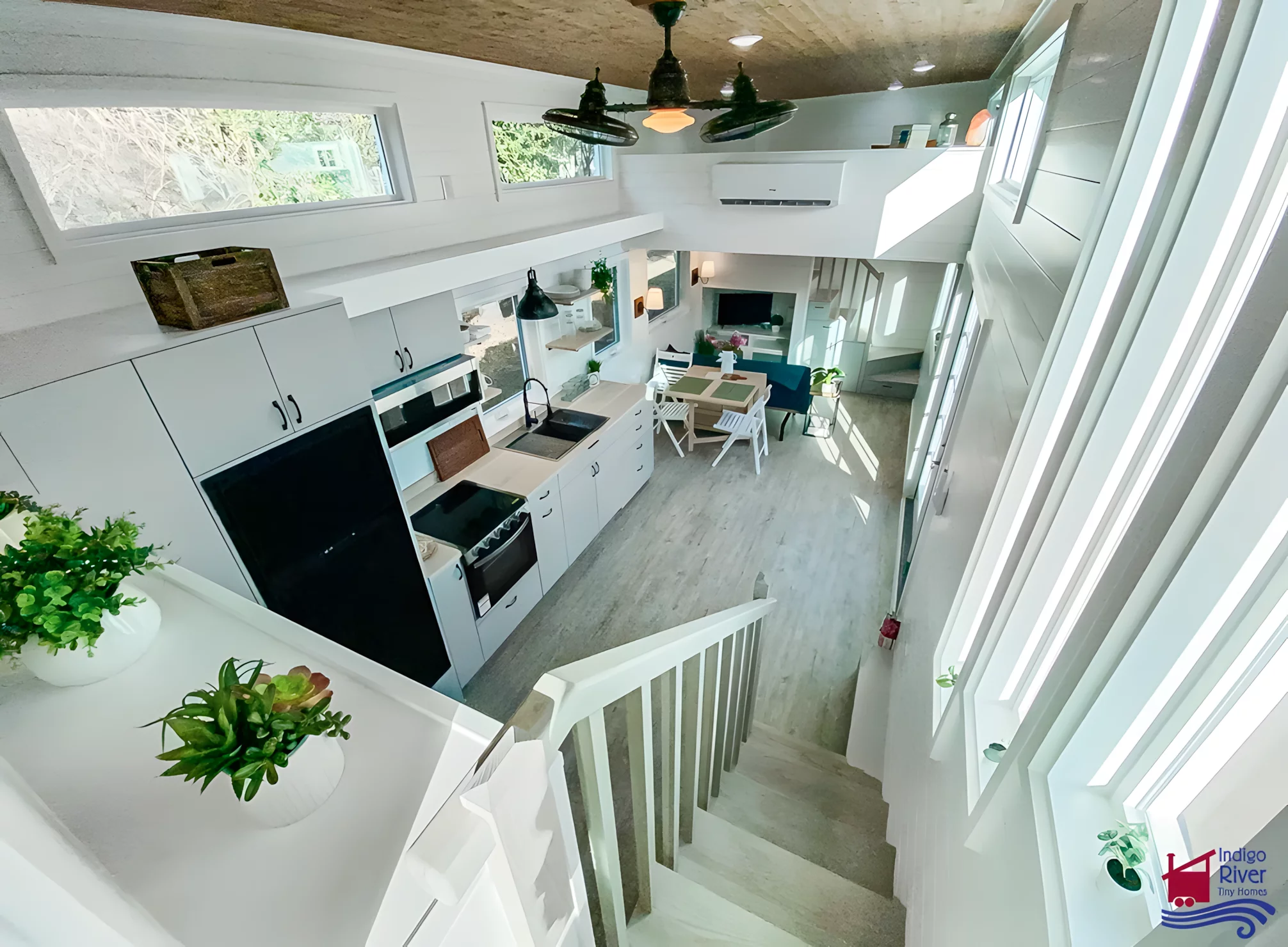 The Elsie's French doors open onto the kitchen, which looks quite open and spacious for a tiny house