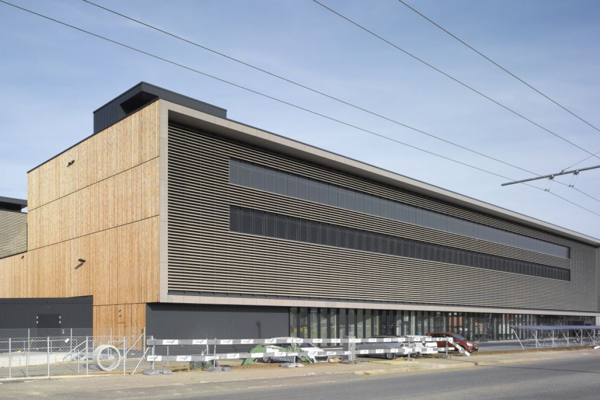 The sleek rows of windows in the building's recessed oblong front combine with the wood finish to create the impression of a piece of 1970s consumer electronics (Photo: Buckhardt+Partner)
