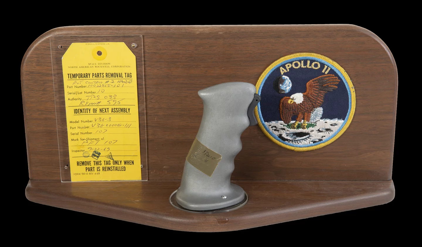 $370,000 | Neil Armstrong's Apollo 11 Control Joystick | Julien's Auctions | Estimate: $100,000 - $200,000 | 18 July 2020 | The original rotational attitude control stick (aka rotation hand controller) from the Apollo 11 command module Columbia in 1969. This control handle, located near the right hand of astronaut and mission commander Neil Armstrong (positioned in the left couch of the command module) allowed navigation of the spacecraft's attitude using roll, pitch, and yaw adjustments. The control stick is fitted with a trigger switch for activating the headset microphone. Included is a wooden display mount with an Apollo 11 mission patch and the original parts removal tag (dated September 22, 1969) with matching serial numbers and official NASA stamps. Part number 10022865-101. Serial number 10. NOTE: The provenance of this item has been corroborated by an official NASA audit report published by the Office of Inspector General in 2018.