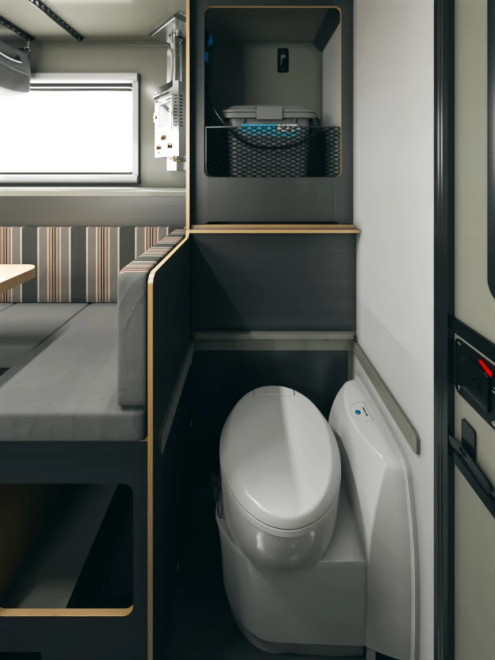 The available toilet tucks away to the right of the entry; the RinseKit shower stores on the shelf behind it; and a curtain closes around the shower pan in the entryway to create a functional wet bathroom