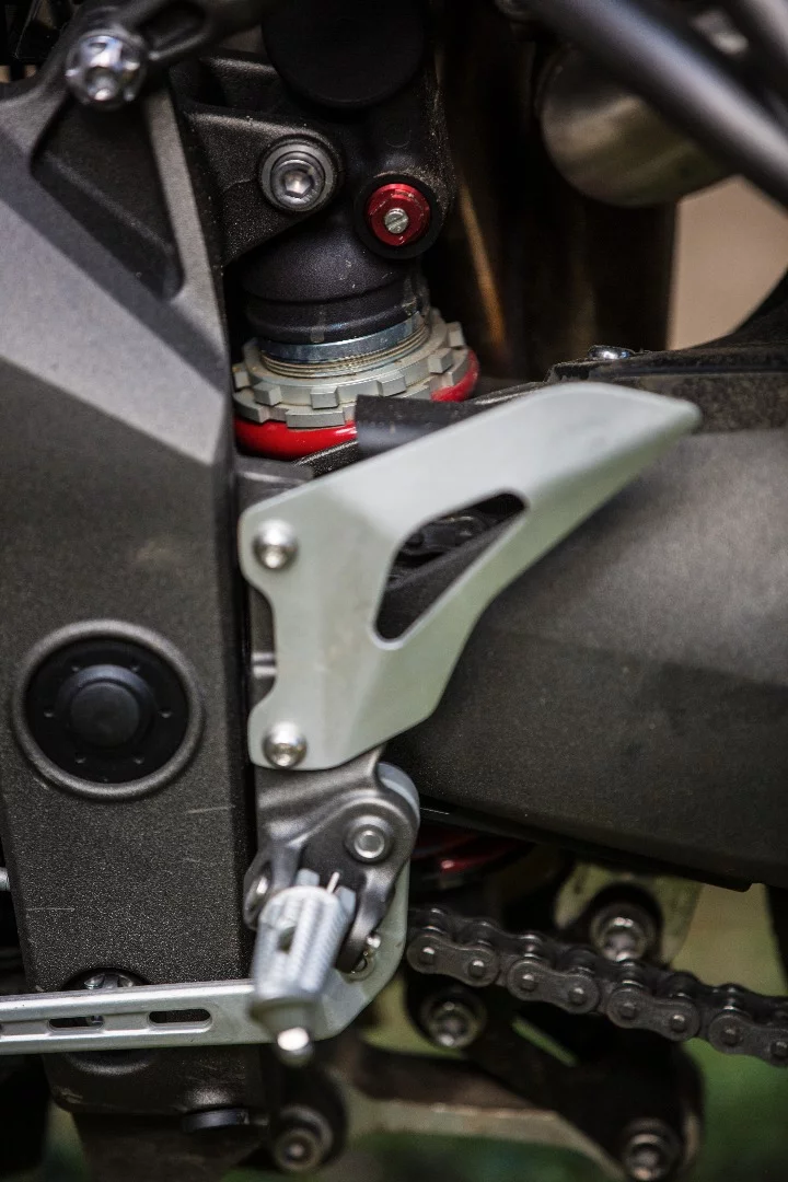 Triumph Speed Triple S: fully adjustable rear shock is only fully adjustable if you pull off the exhaust. Otherwise you can't get a c-spanner onto the preload collar.