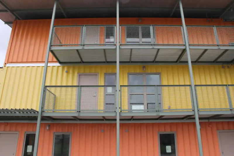 A secondary roof creates a thermal break and reduces direct sunlight onto the homes