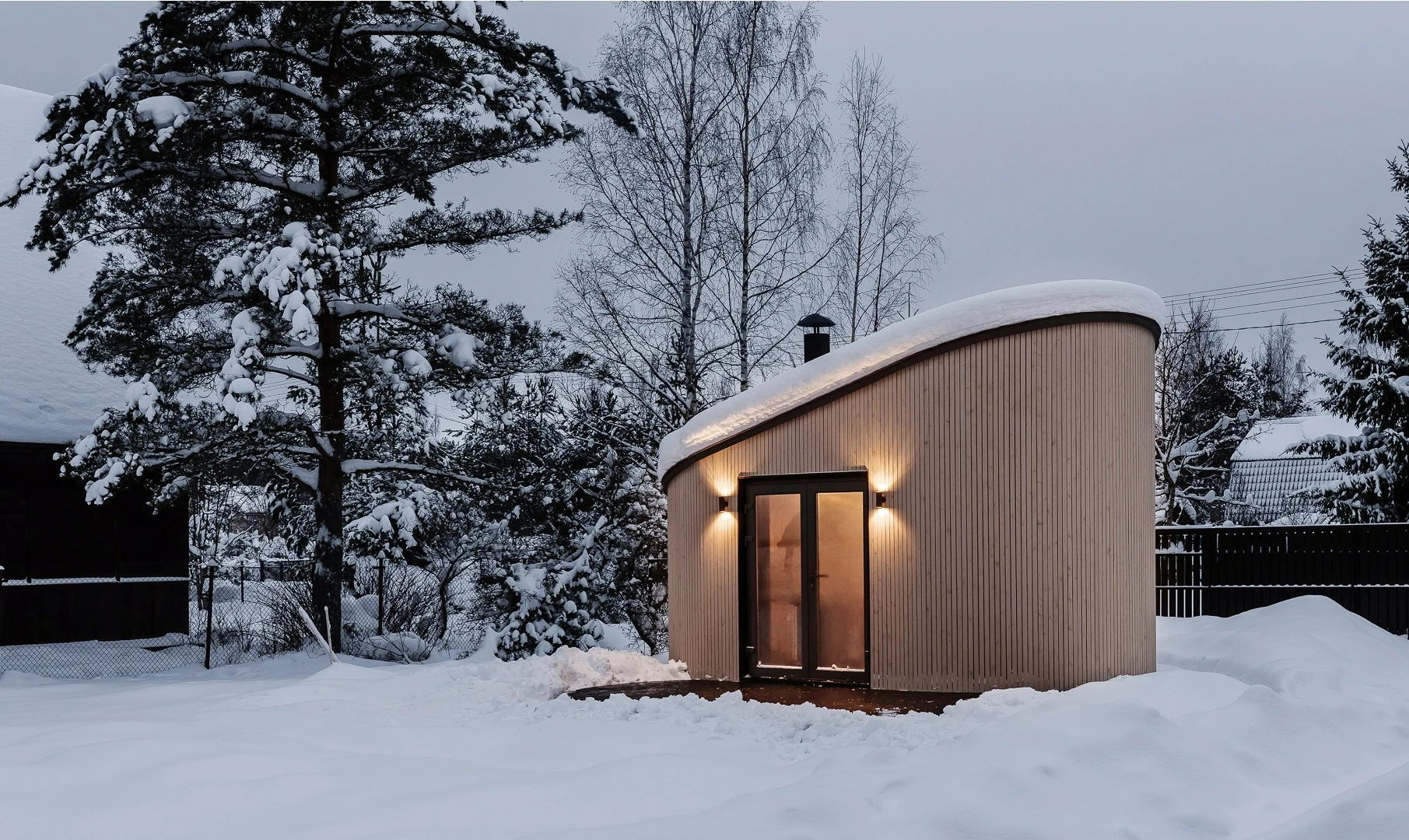 Featuring double opening glass doors and a large porthole window, the Flexse tiny module is designed to take advantage of the outdoors
