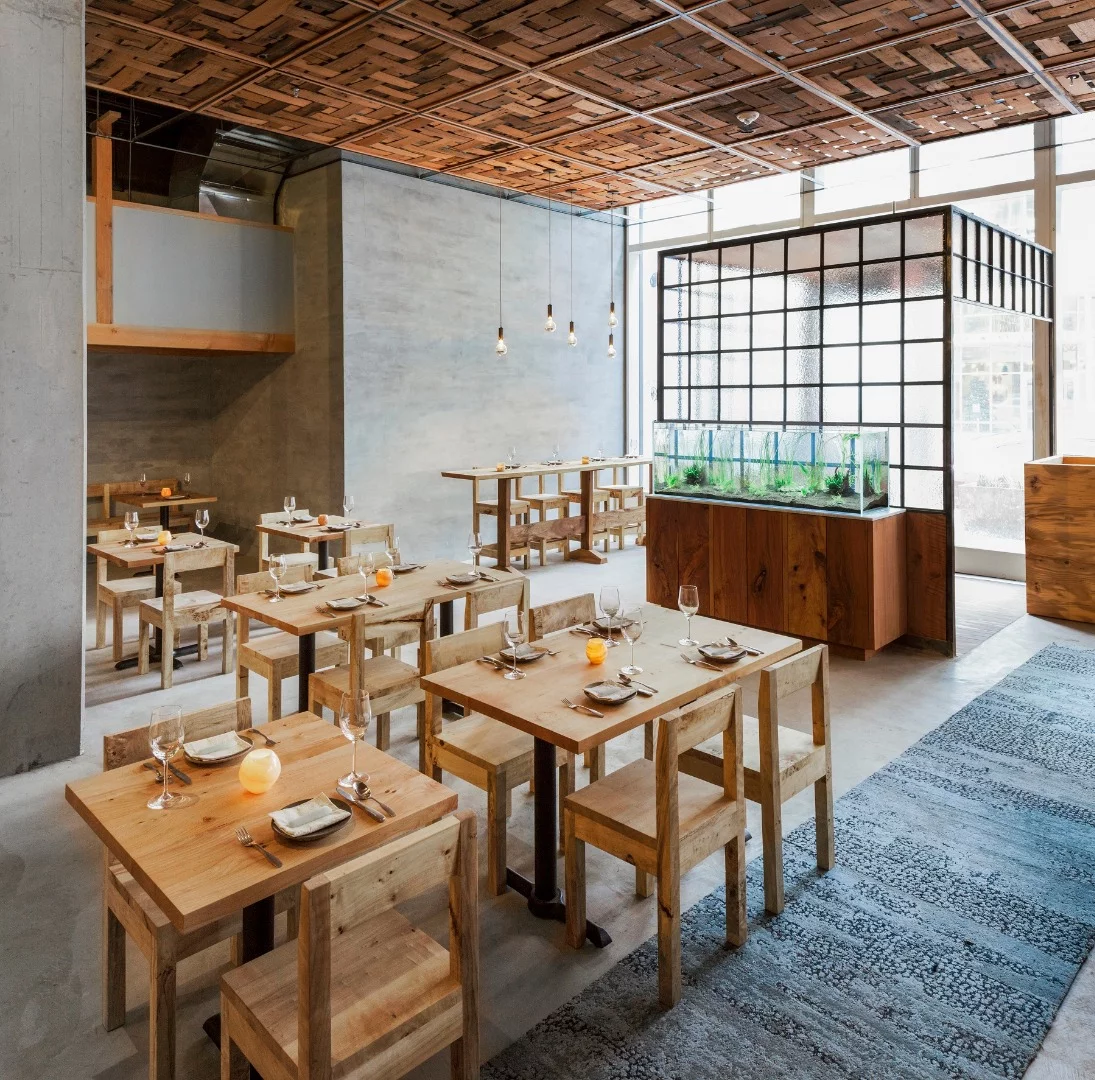 Among the features of the Perennial's dining room are reclaimed lumber, a 100 percent recycled and recyclable rug, recycled tiles, plaster made from marble-processing waste and recycled glazing
