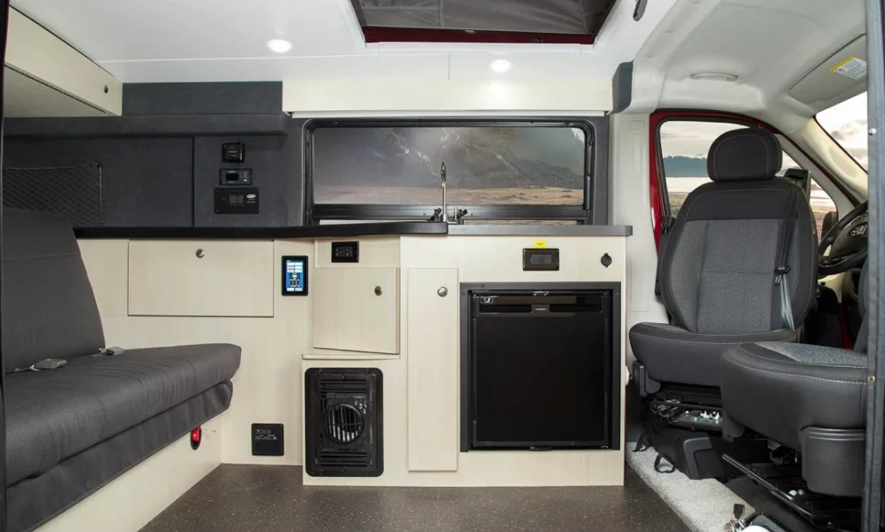 Pleasure-Way sticks with a simple folding bench interior with electric-powered kitchen block