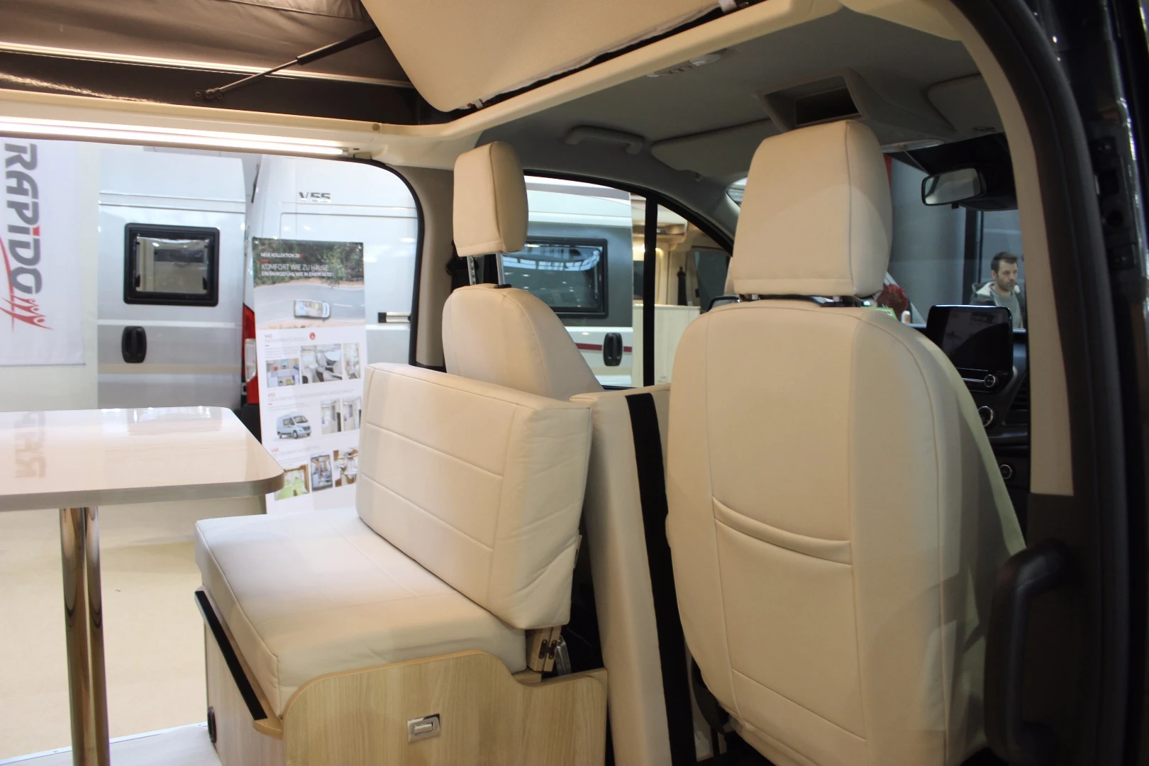 A bit of a different spin on the front dinette, Dreamer puts a rear-facing double bench inside its Cap Land Select rather than relying on cab swivel seats