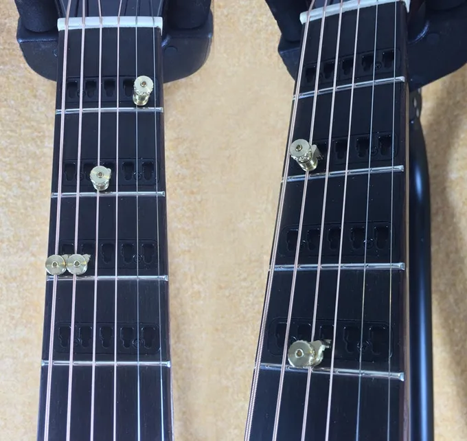 The premium Gillis Capo Guitar features capo inserts in the neck up to the 9th fret, while the basic dreadnought goes up to 12
