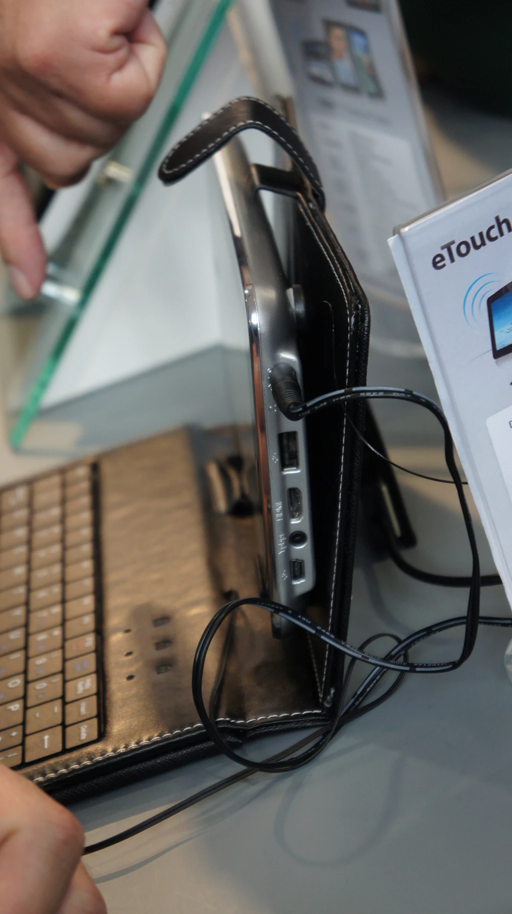 The keyboard case connects to the eTouch tablet via USB