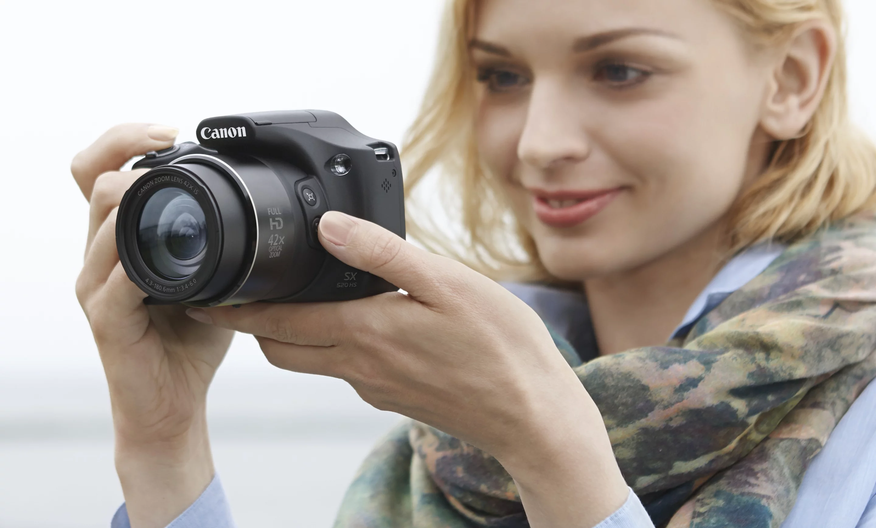 Canon has added two new super-zoom bridge cameras to its PowerShot line-up, the SX520 HS and SX400 IS