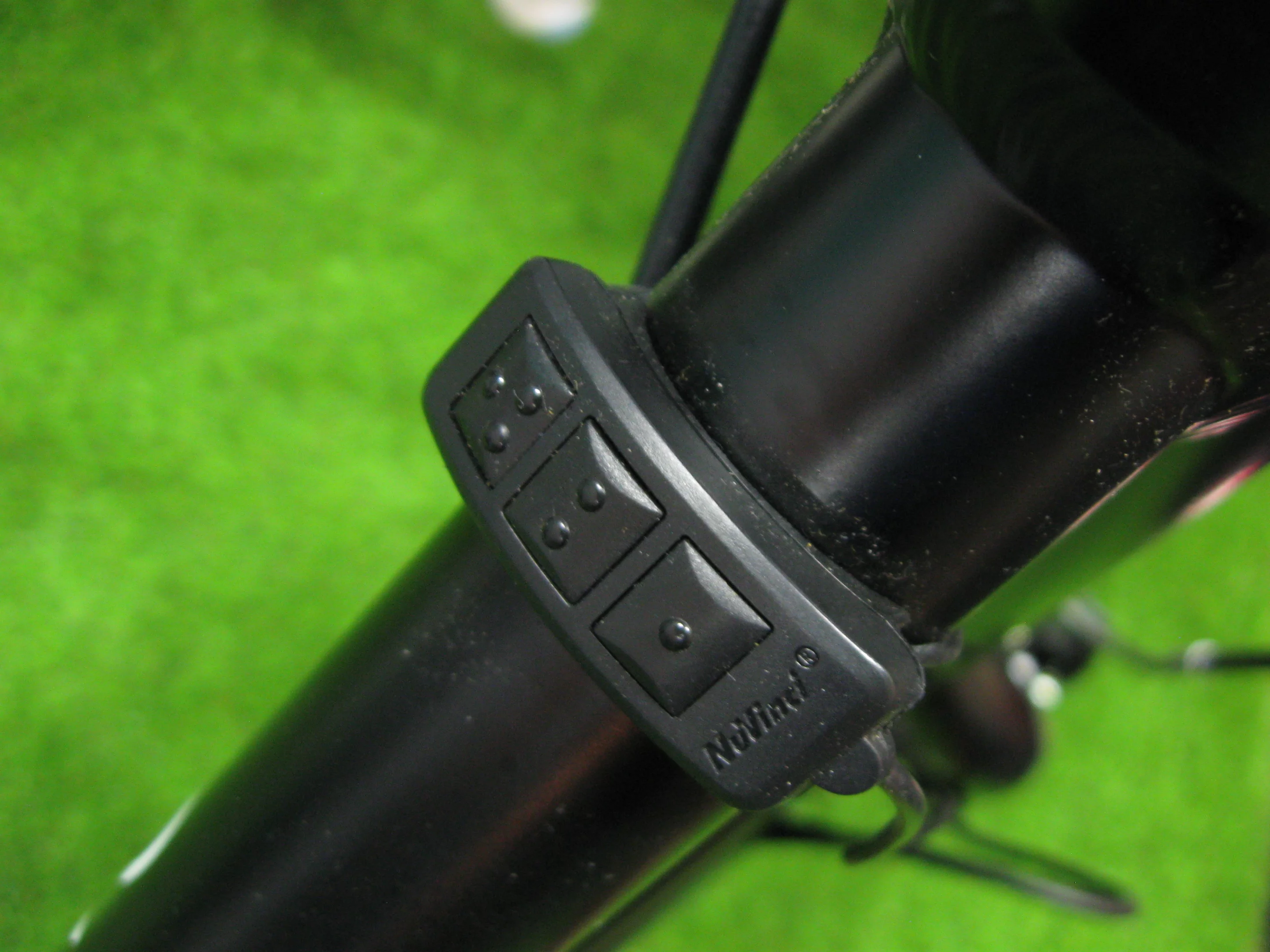 The down tube-mounted pedaling speed buttons