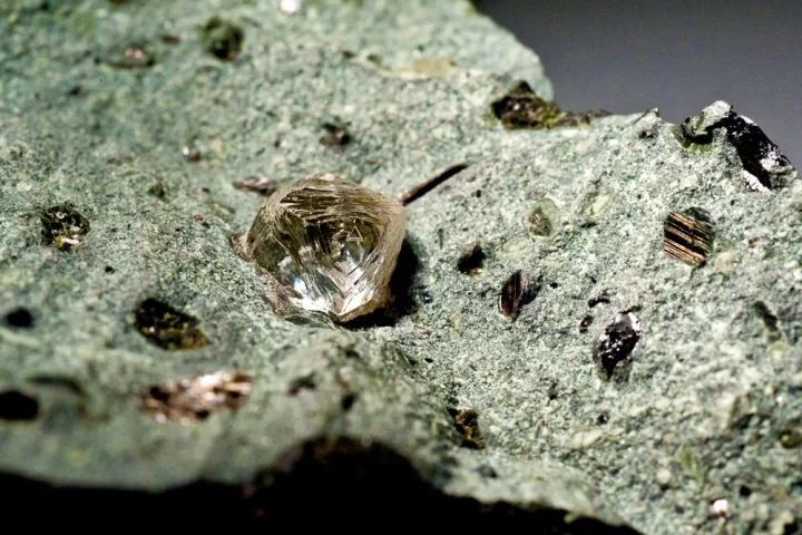 A raw diamond in a piece of kimberlite ore