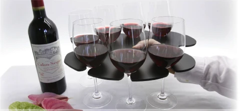 The Stem Glass Tray holds eight wine glasses in balanced formation and has a hole for your thumb