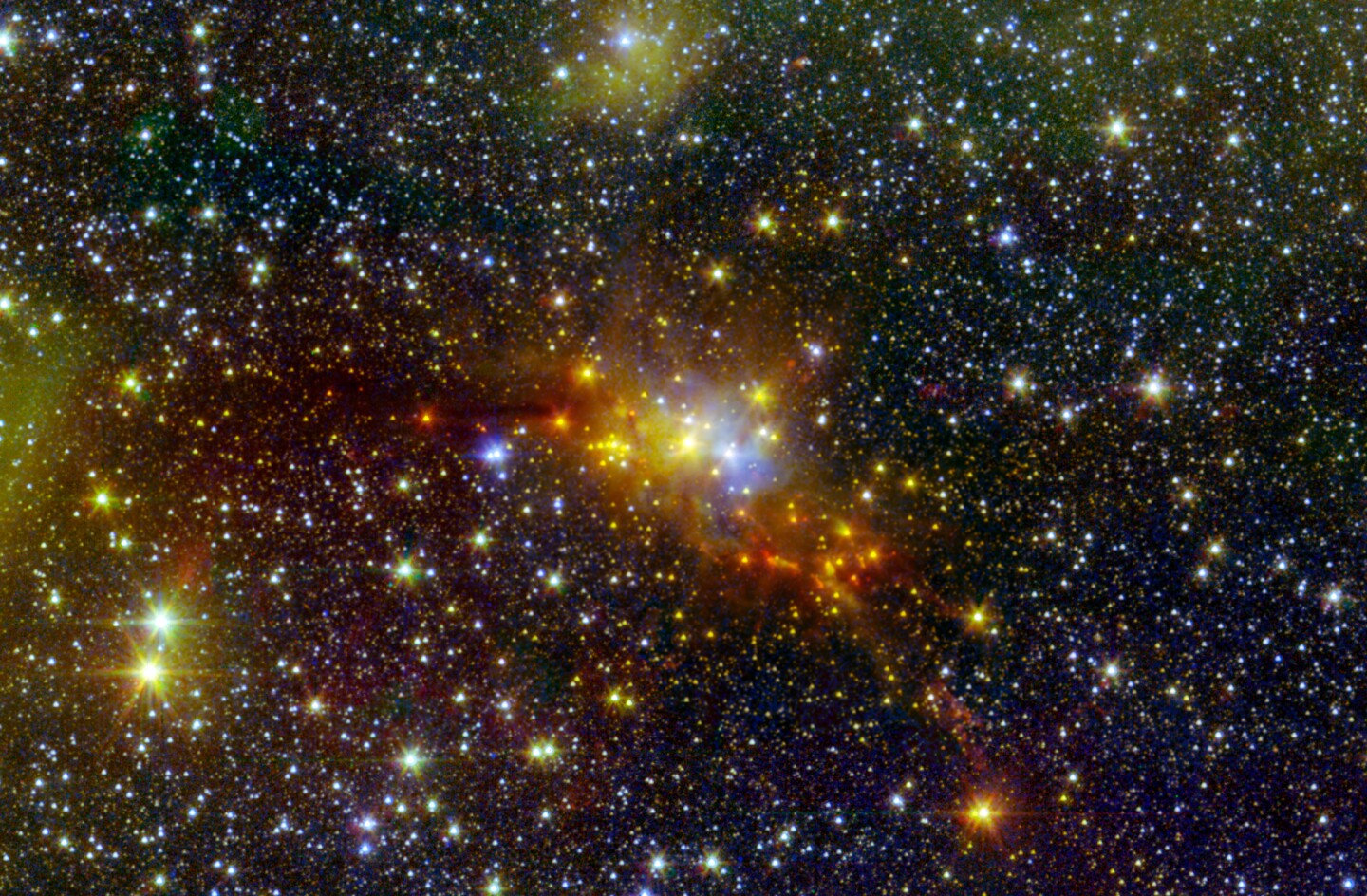 This star-studded shot shows the area around the Serpens constellation, where new stars are rapidly being formed. The red and orange ones towards the center of the image are the youngest, birthed in the dark cloud there.