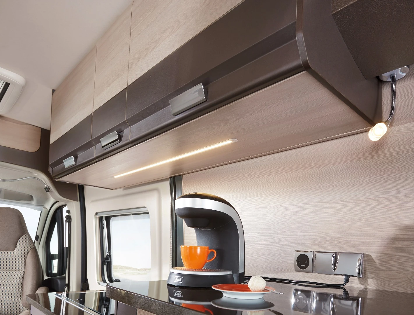 What looks like a cupboard is actually the refrigerator
