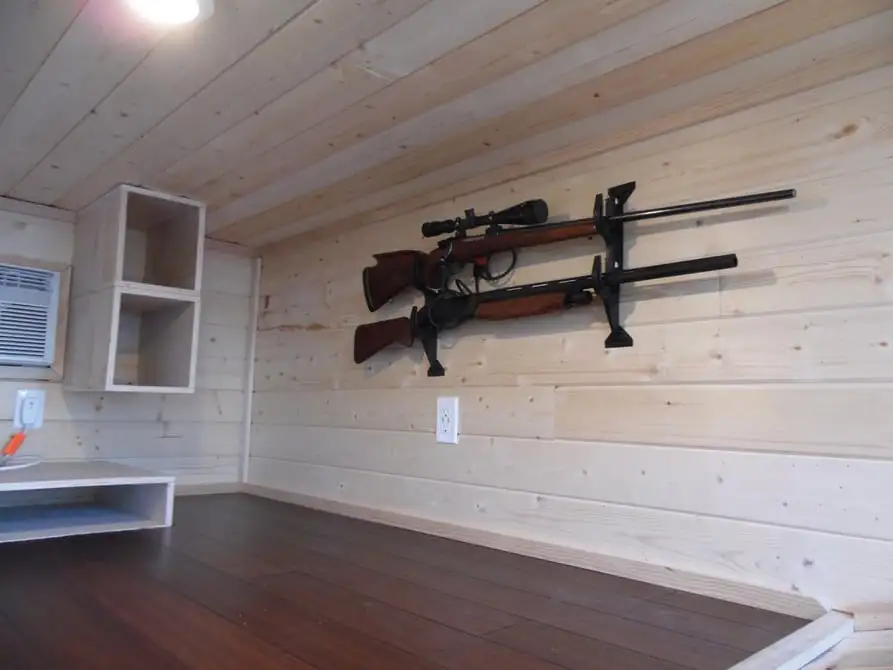 The Man Cave features gun racks and fishing gear