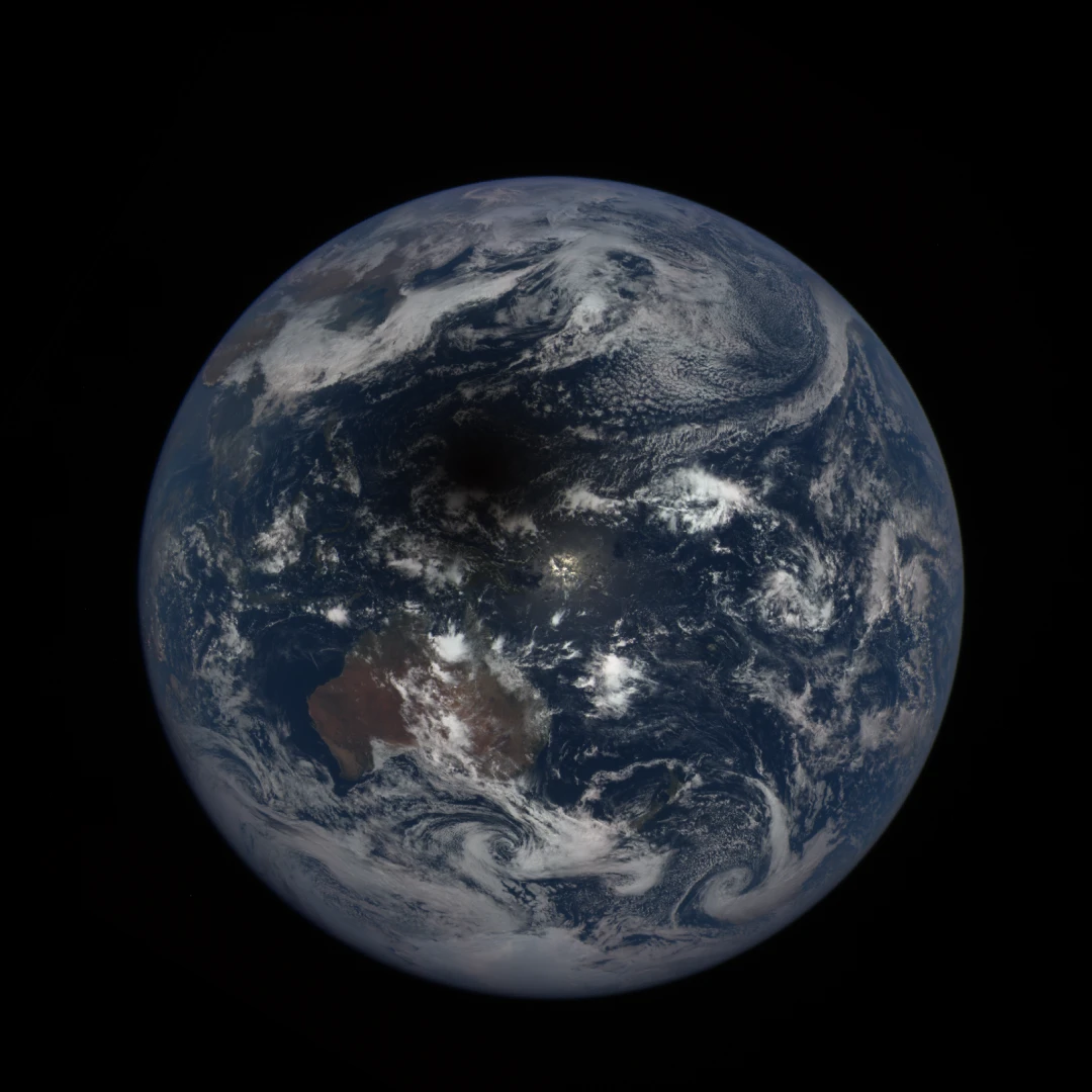 The shadow of a total solar eclipse crossing over the Earth in 2016