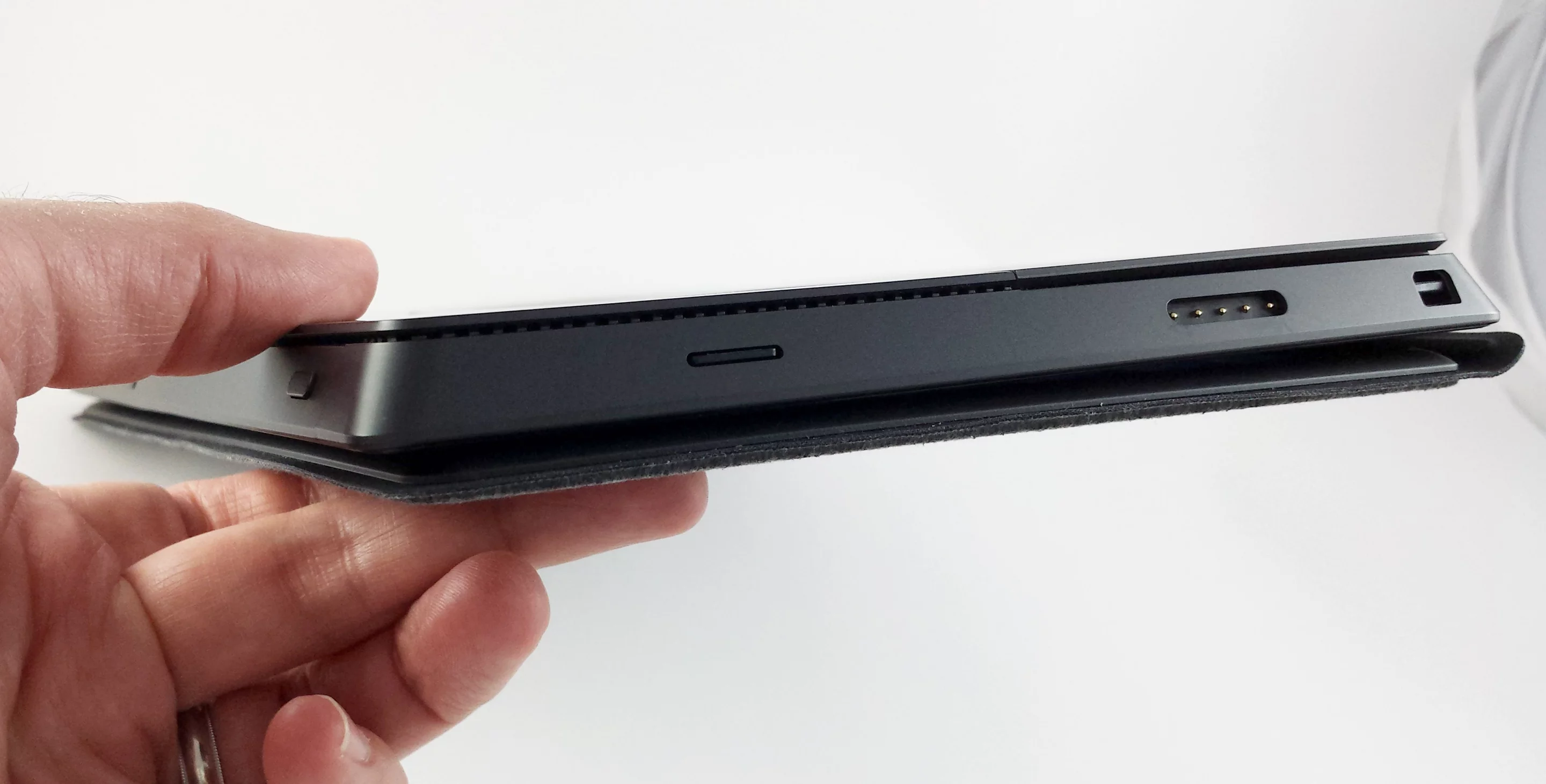 The Surface Pro is 13.5 mm thick, without the cover