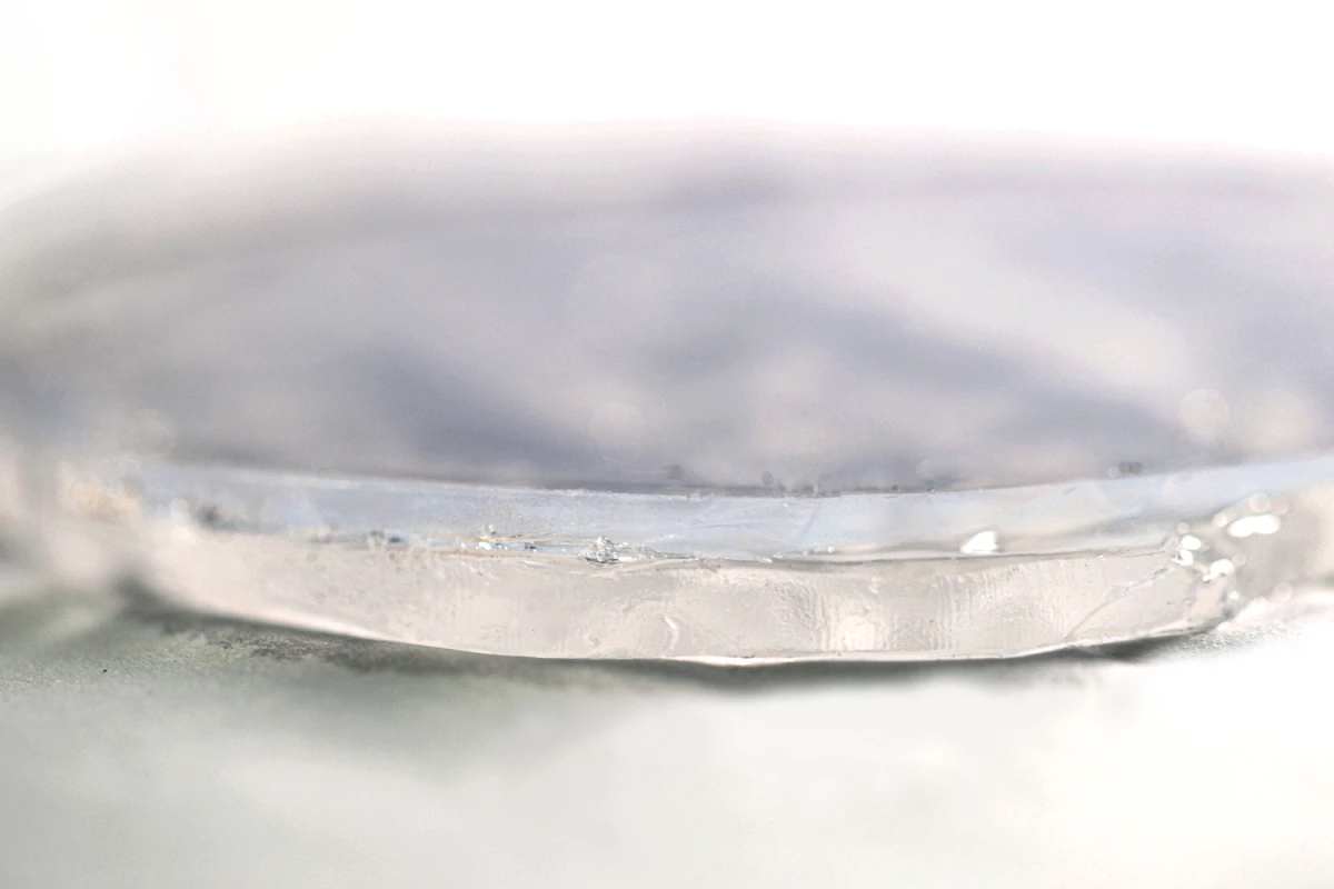 Less than half an inch (12 mm) thick, the two-layer material consists of a hydrogel on the bottom and an aerogel on top