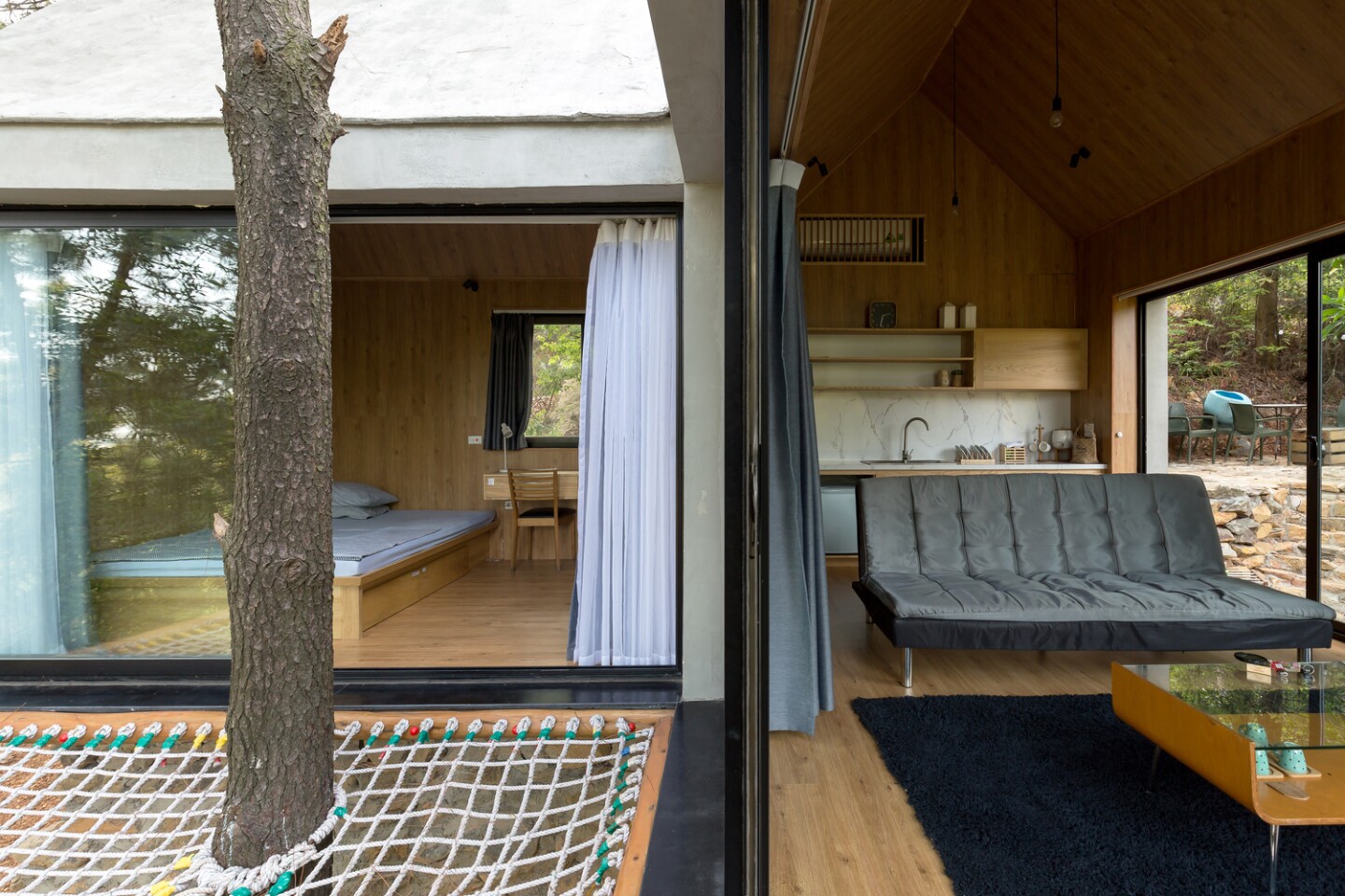 Inspired by treehouses, the home also features a fun exterior net terrace that adjoins both the living area and the master bedroom