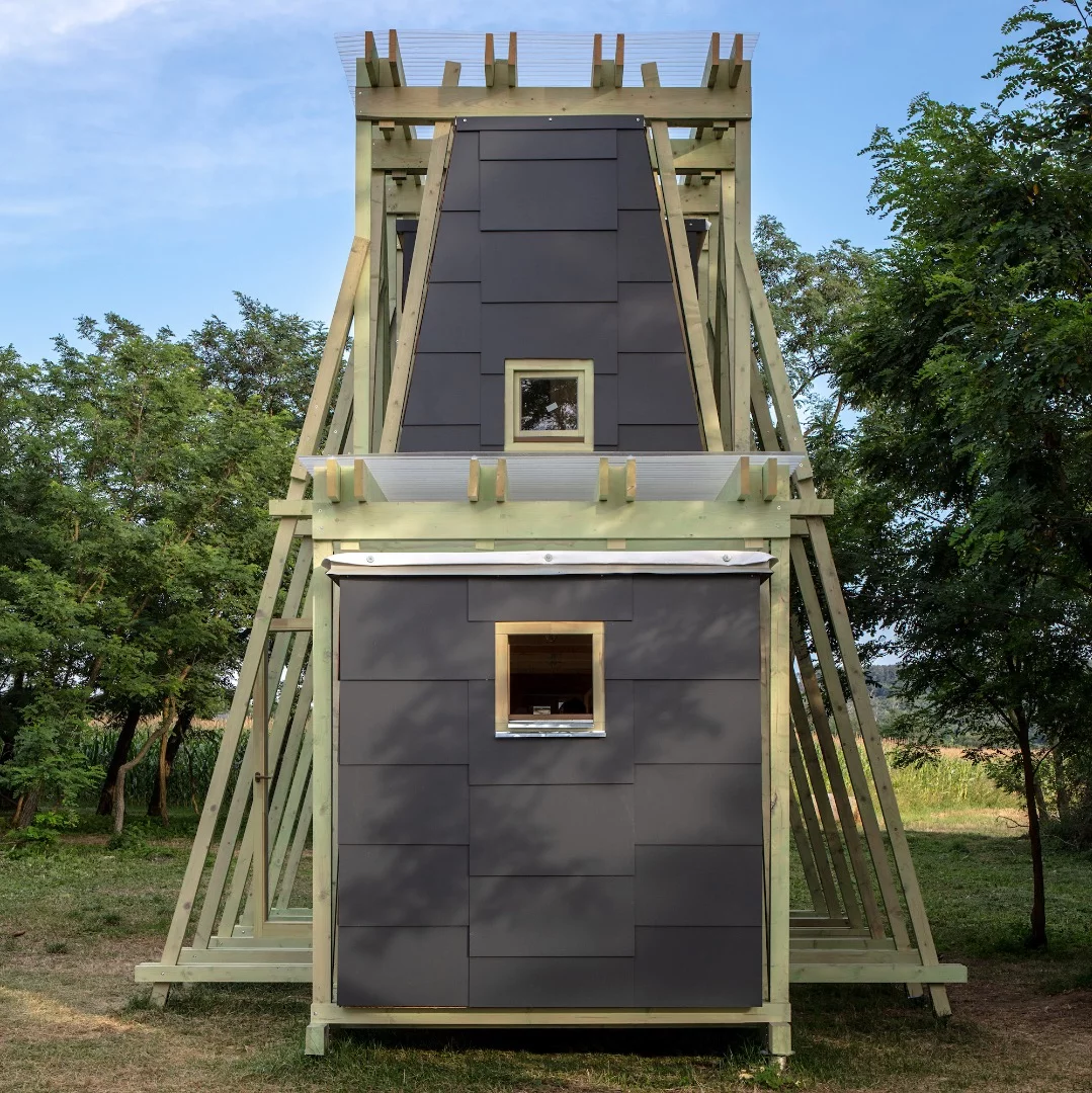 Ziggurat Delivery's ground floor hosts communal activities like a kitchen and living area, while the upstairs includes private areas like bedrooms