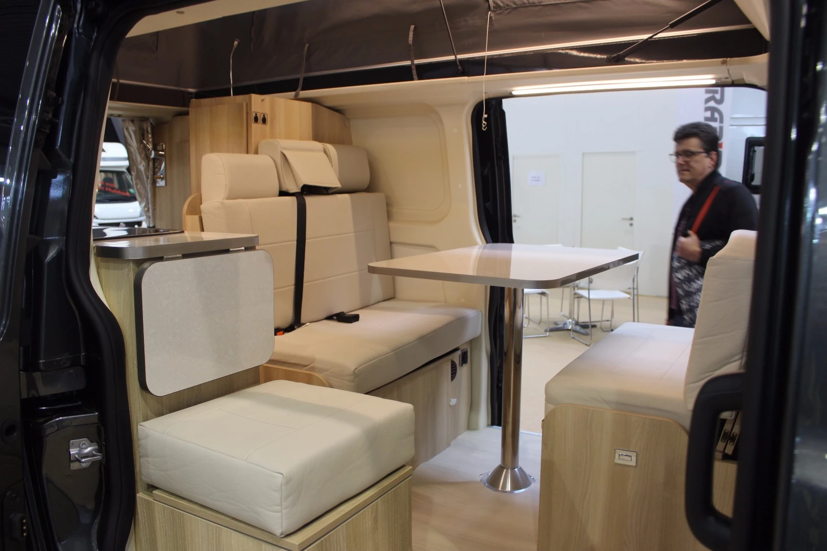 No shortage of seating in the Dreamer Cap Land Select; the compact camper van sleeps four people on the combination of convertible dinette and pop-up roof bed