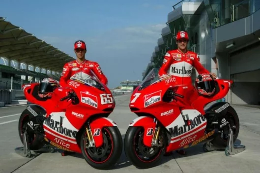 Loris Capirossi and Carlos Checa in pre-season testing prior to Checa's injury