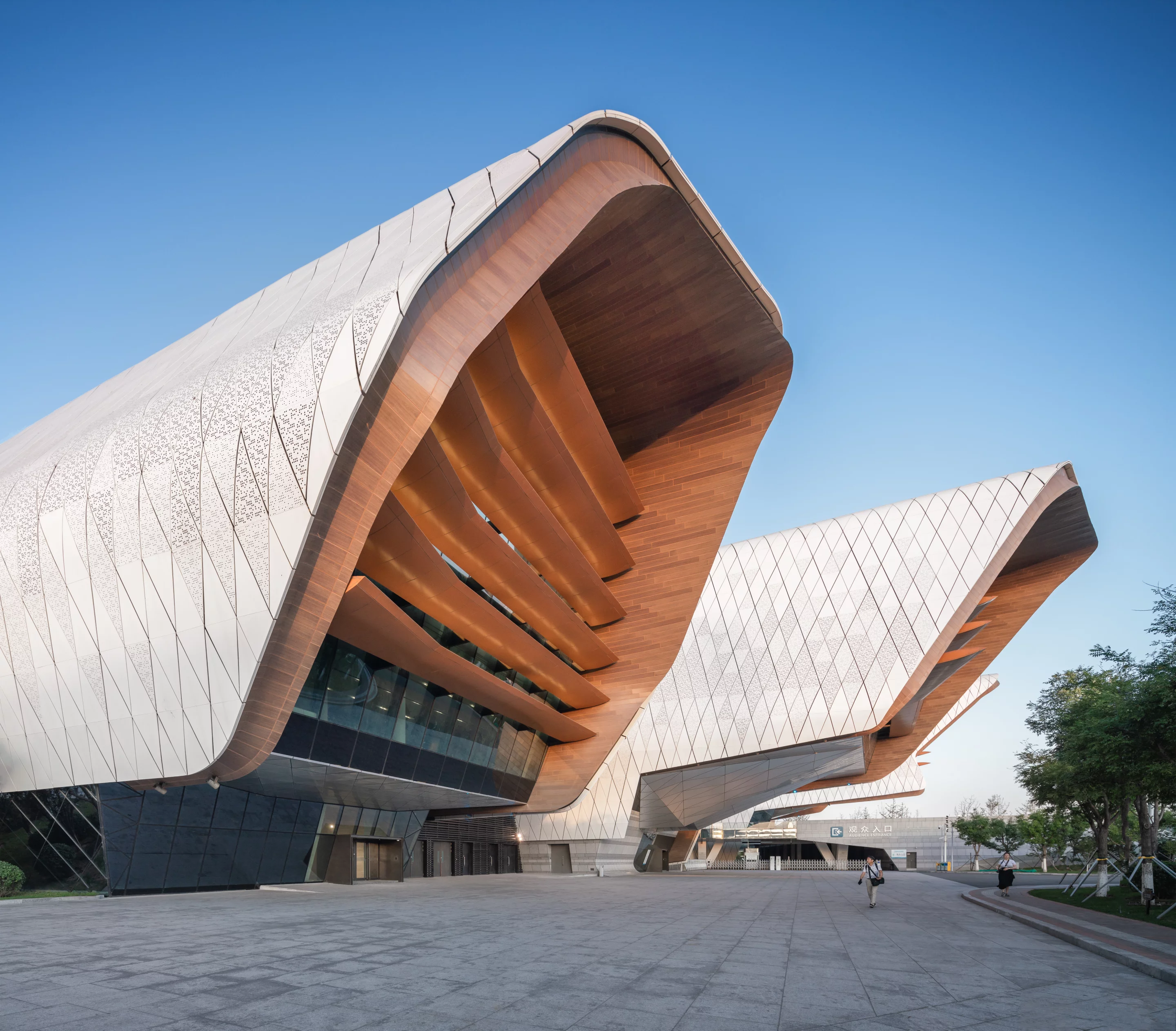 "From Philip Cox’s initial watercolor sketches, the design evolved and certain compelling metaphors either resolved or emerged – jumping carp, corals, starfish, moored ships in port and an open palm reaching out from China to the maritime world," says Cox Architecture