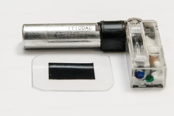 A typical smartphone flash with its existing capacitor (silver cylinder), and the new polymer capacitor material (lower left)
