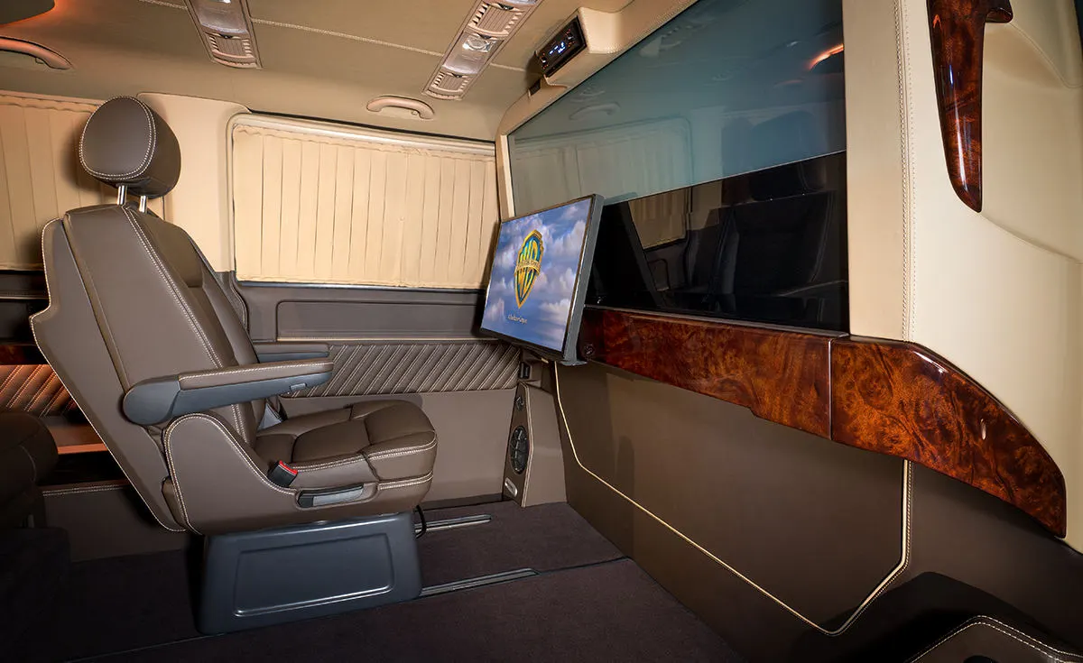 The 27-in TV slides along the partition wall to adjust for single and multi-passenger audiences