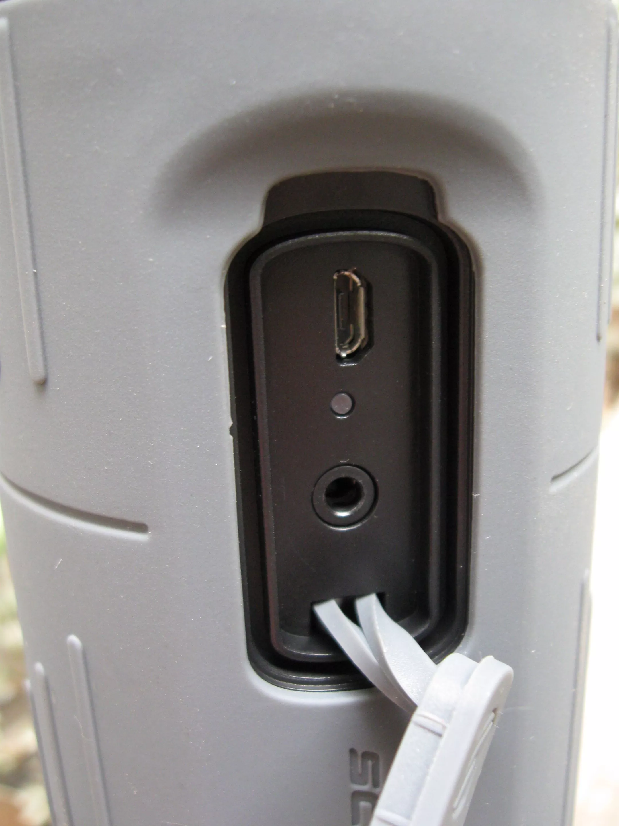 The sealed micro-USB charging port and 3.5-mm audio input