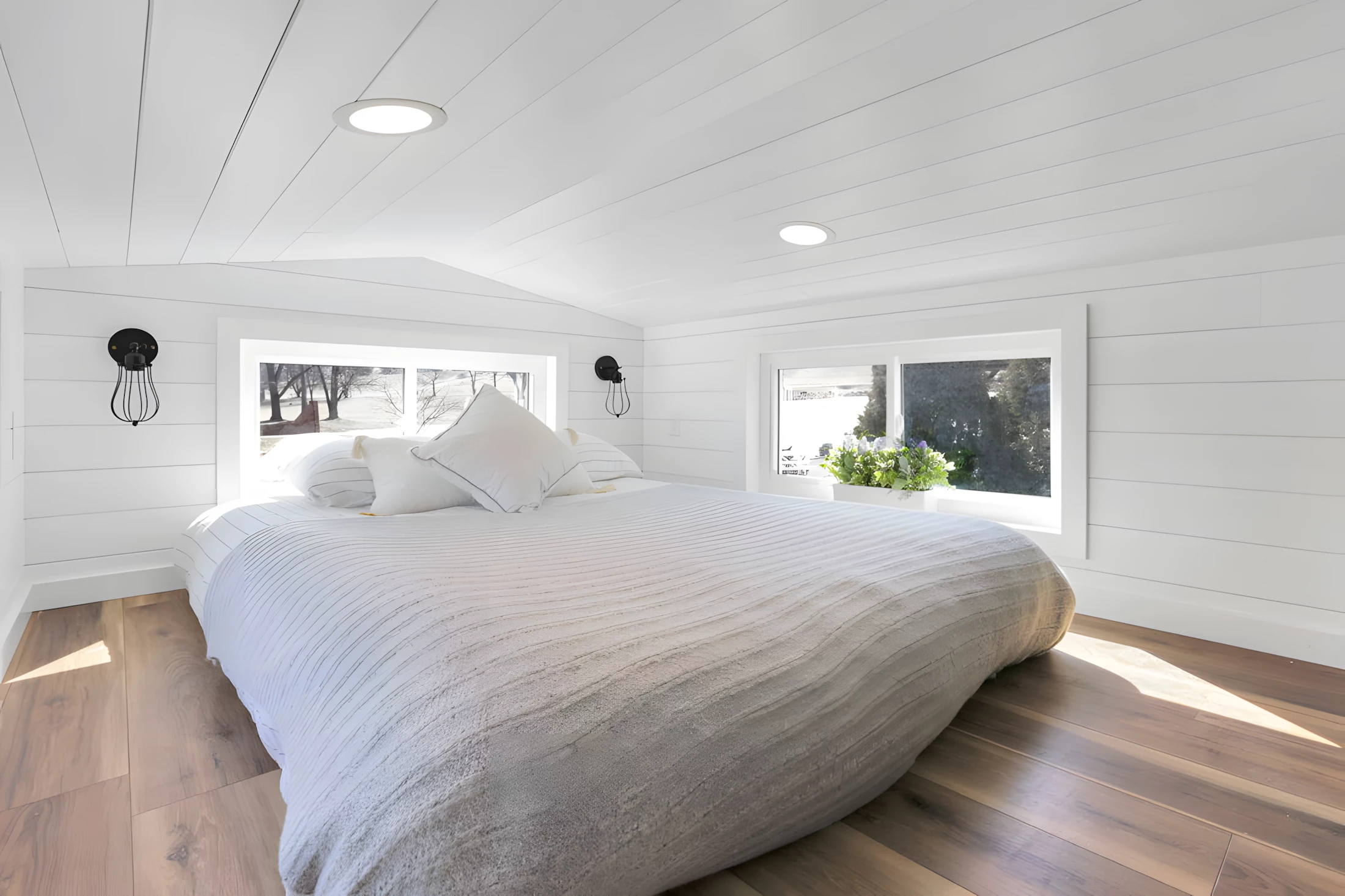 The Shadow's bedroom is a typical loft with a low ceiling and a double bed