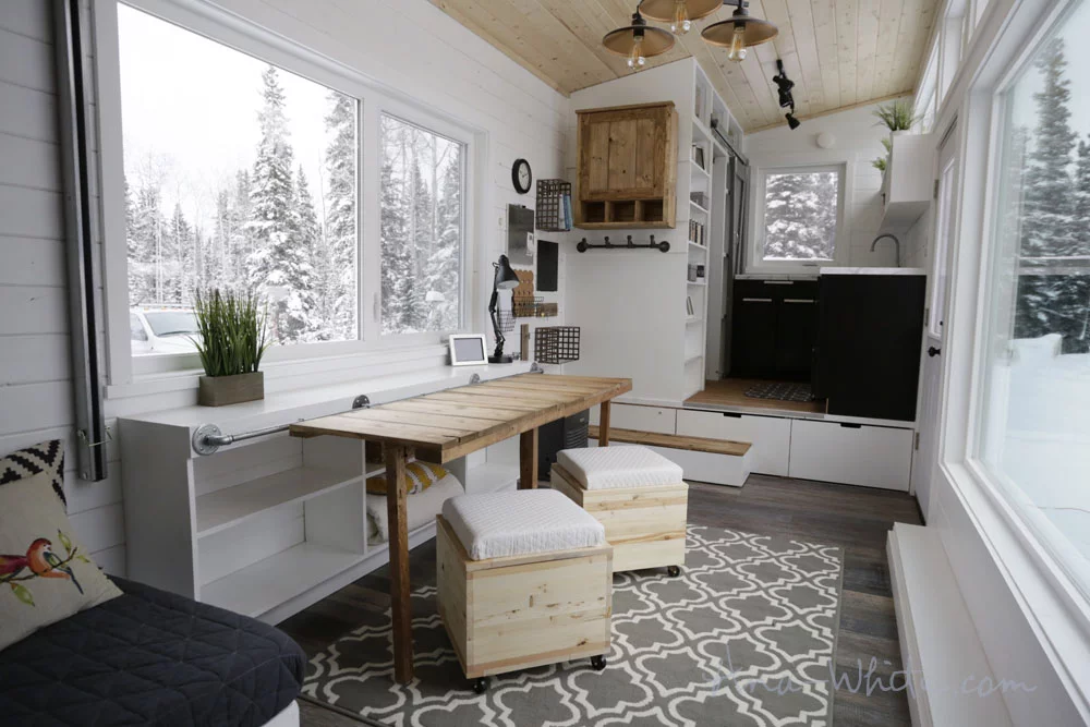 The Open Concept Rustic Modern Tiny House's storage unit, configured as one large desk