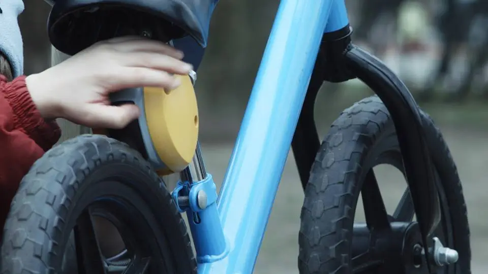 Once the brake has been applied, a second push of the button will release the brake and set the wheel in motion