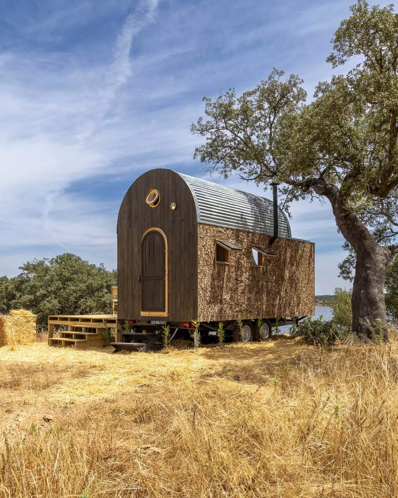The Terra m1_Tiny House on Wheels' exterior is finished in timber and cork