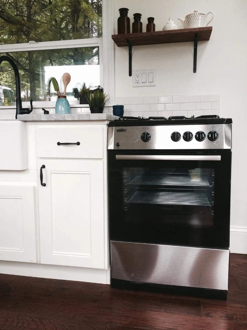 The Vintage Glam's kitchen also includes an oven