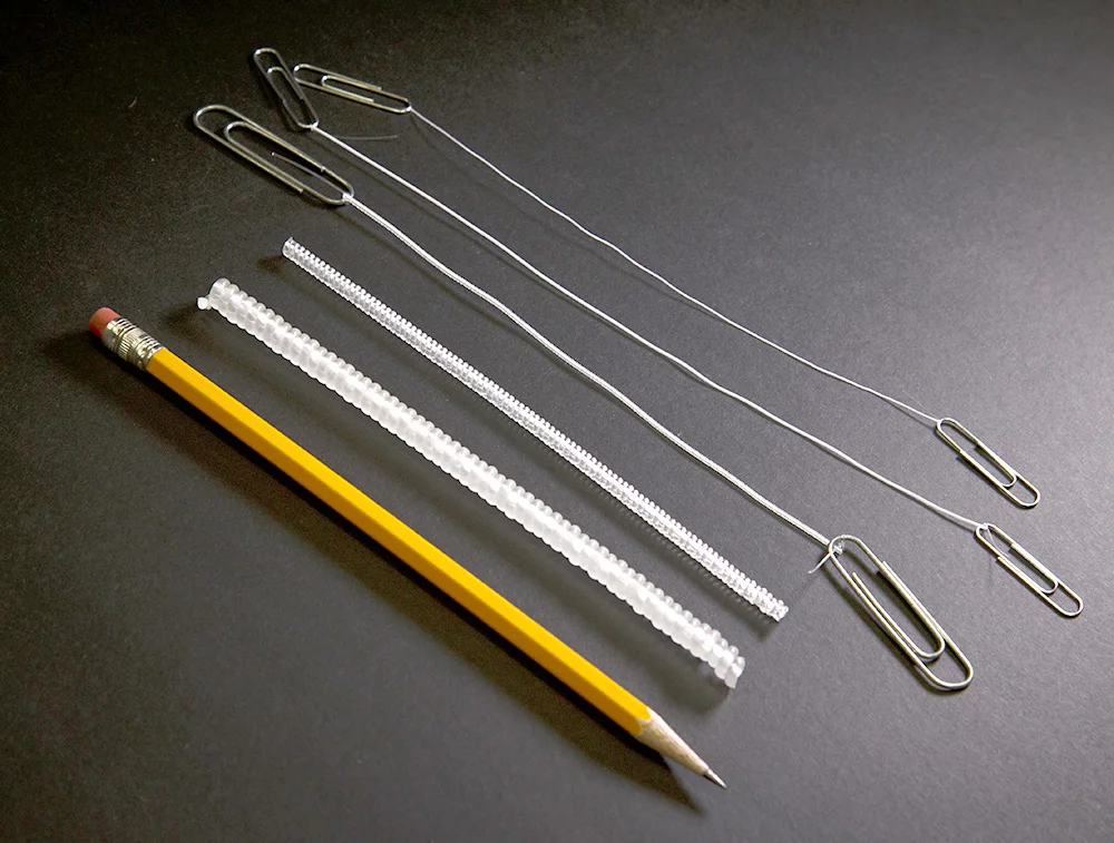 A variety of sizes of the artificial muscles, with a pencil for scale (Photo: University of Texas at Dallas)