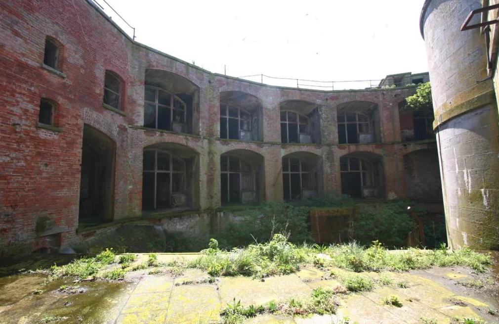 The circular fort takes up most of the barren rock island it sits upon