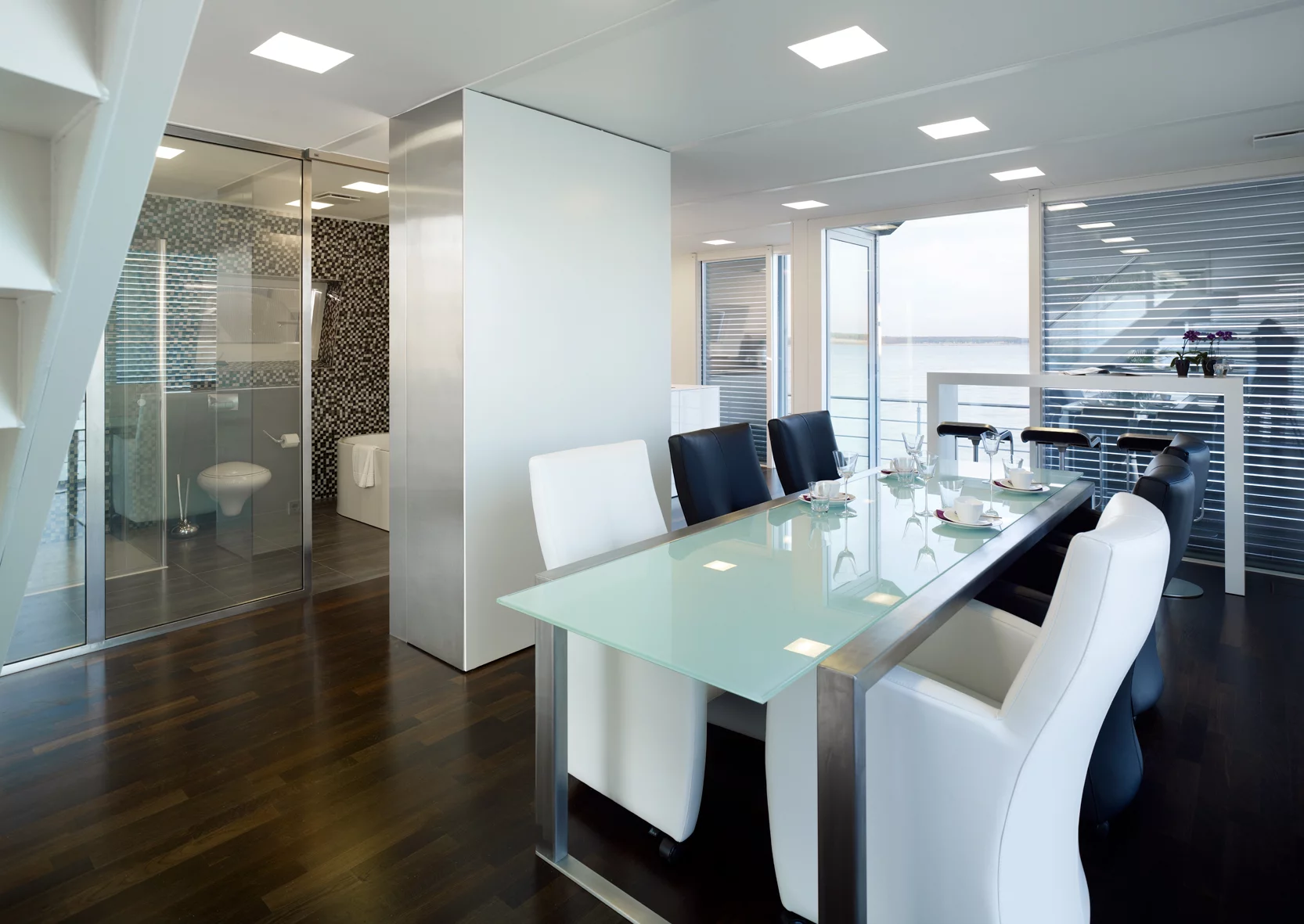 An automated roof-light control system allows natural light to filter through the home